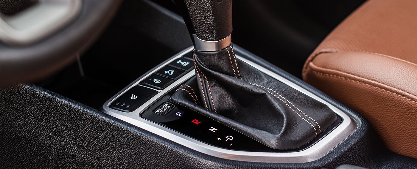 Car's automatic transmission gear selector, showing P, R, N, D, and sport mode settings.