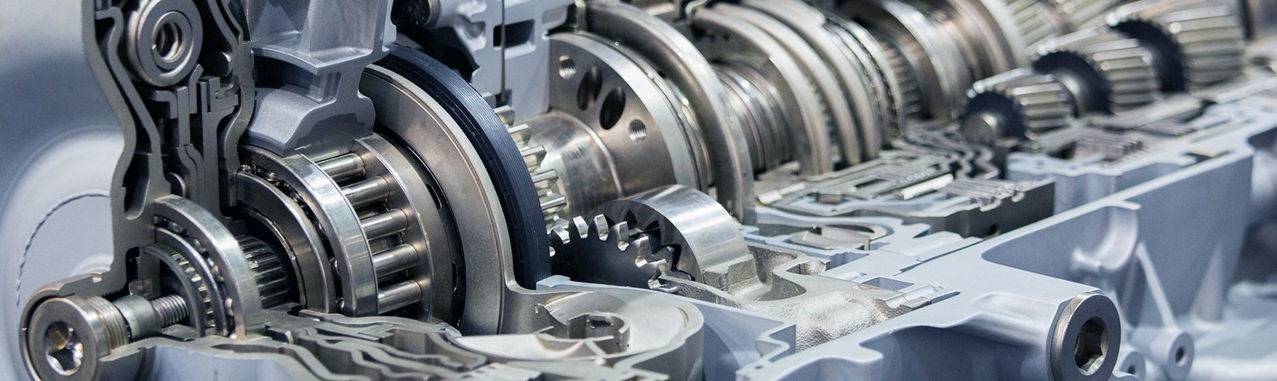 A man is changing the gears in a car.