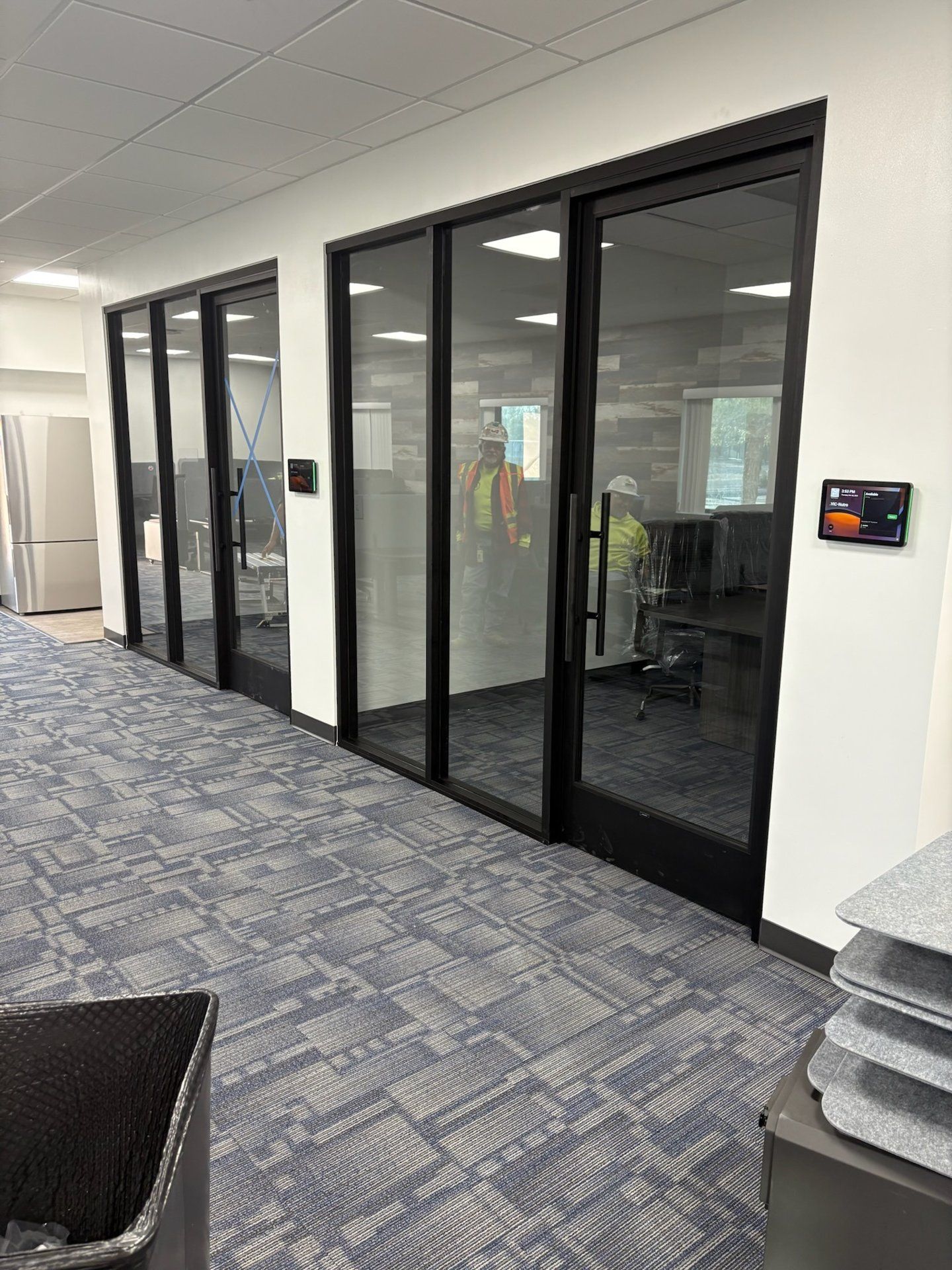 Black aluminum interior office storefront glass partitions by High Desert Window and Glass