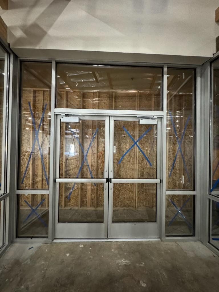 Commercial aluminum double entry doors in a storefront vestibule by High Desert Window and Glass