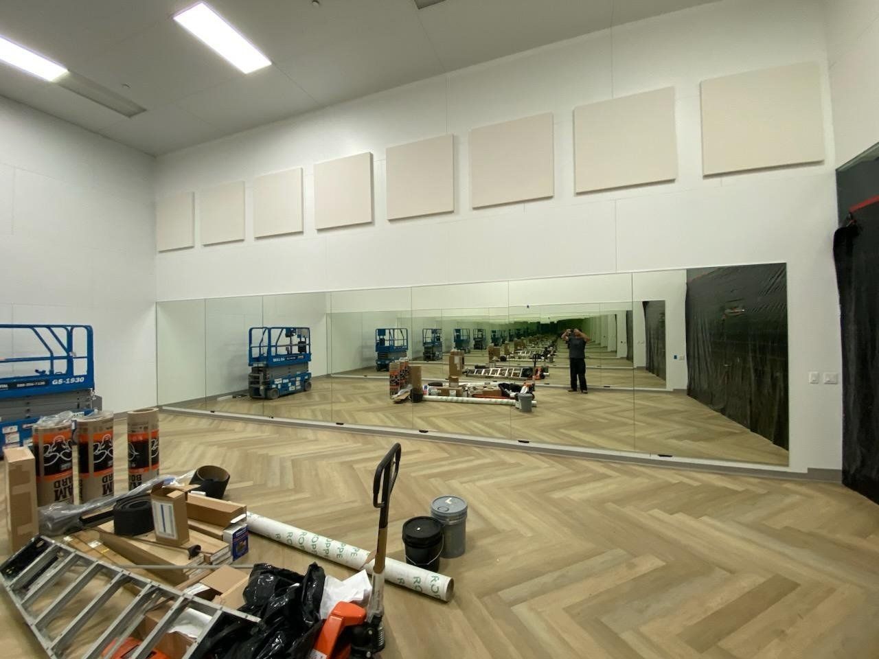 Commercial gym mirror wall installed in a fitness center by High Desert Window and Glass