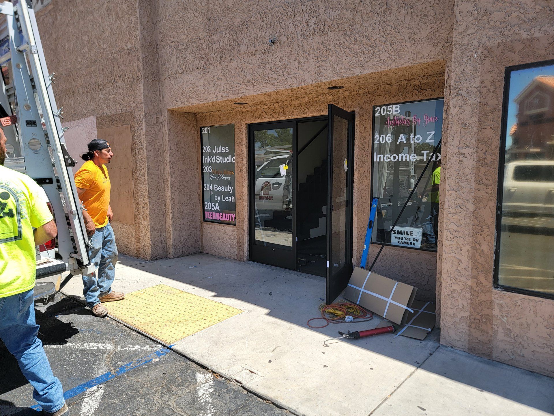 High Desert Window and Glass crew installing a commercial storefront glass door