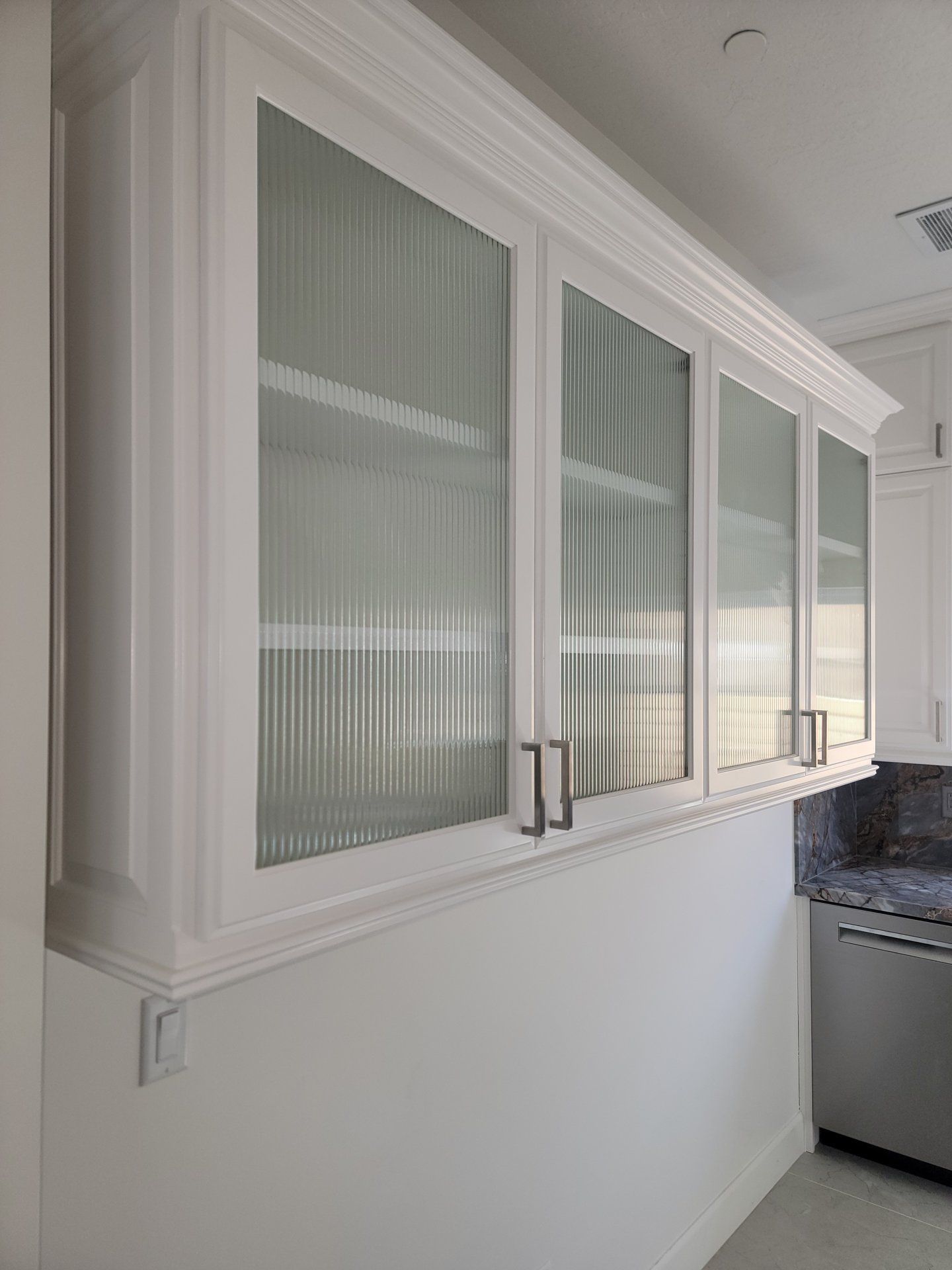 Custom cabinet glass with reeded glass inserts by High Desert Window and Glass