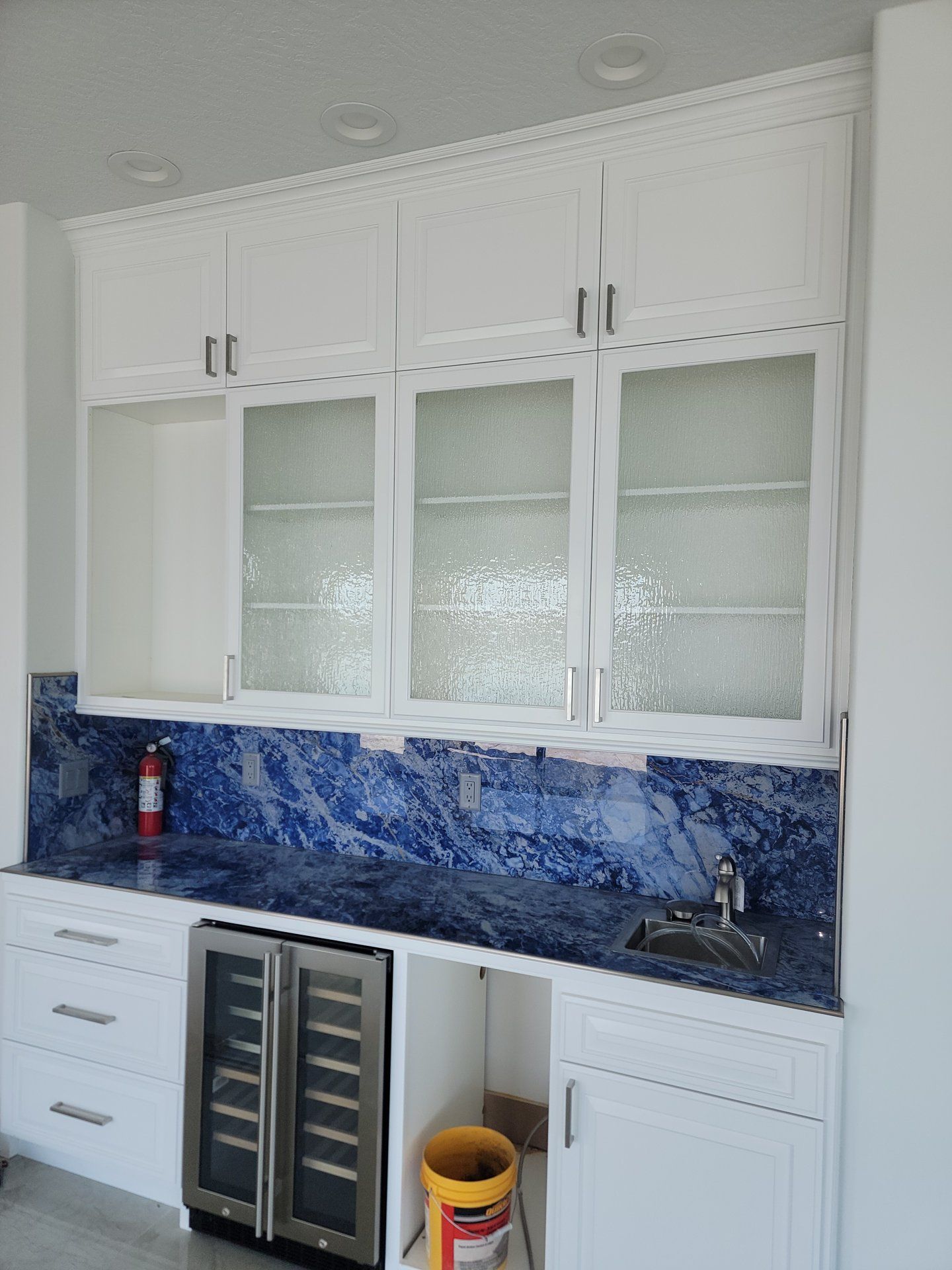 Custom cabinet glass doors on a wet bar fabricated by High Desert Window and Glass