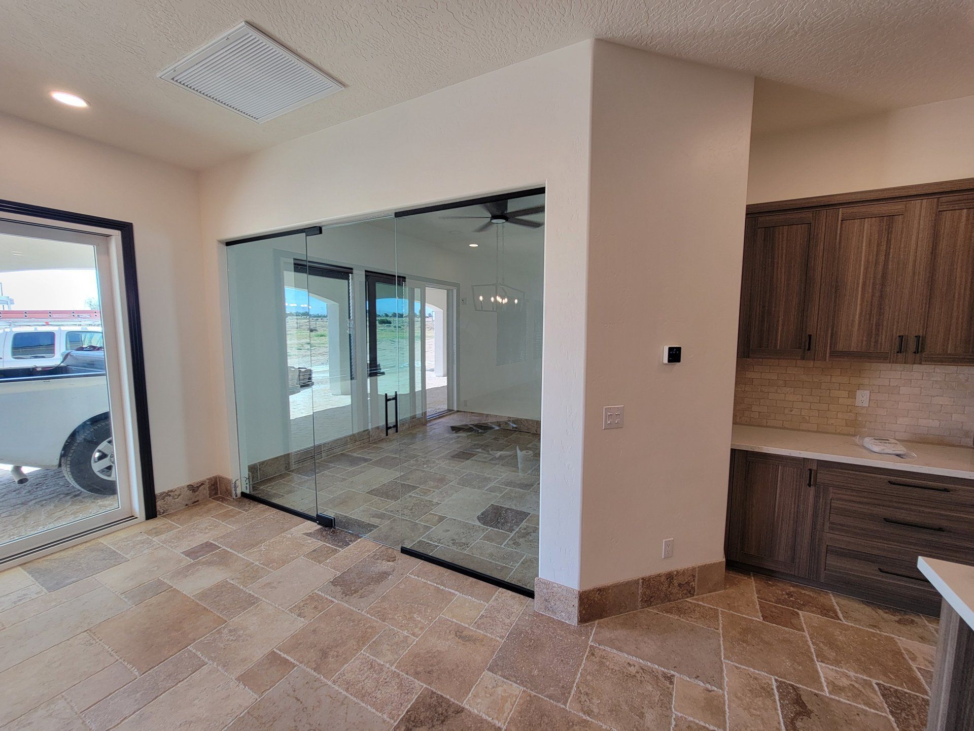 Frameless glass partition wall in a modern interior by High Desert Window and Glass