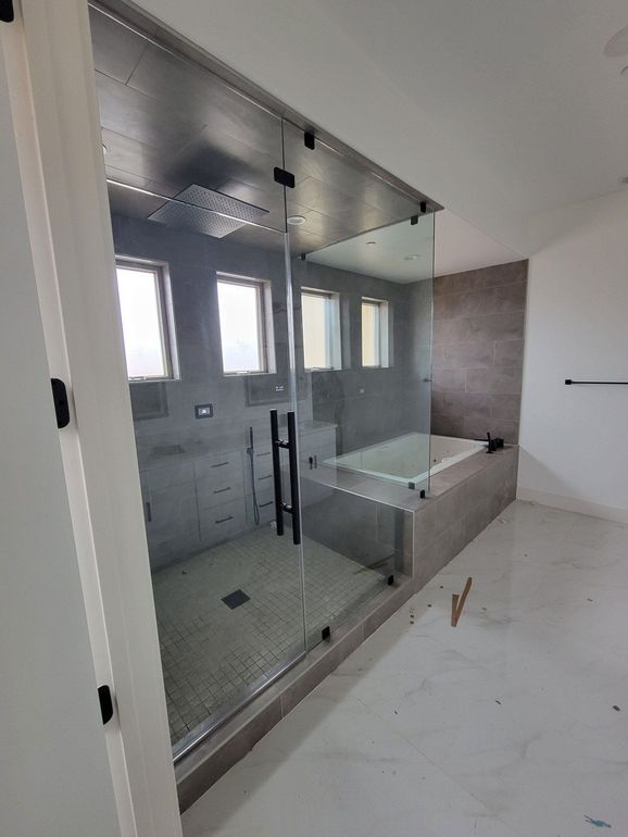 Frameless steam shower glass enclosure with transom in Victorville by High Desert Window and Glass