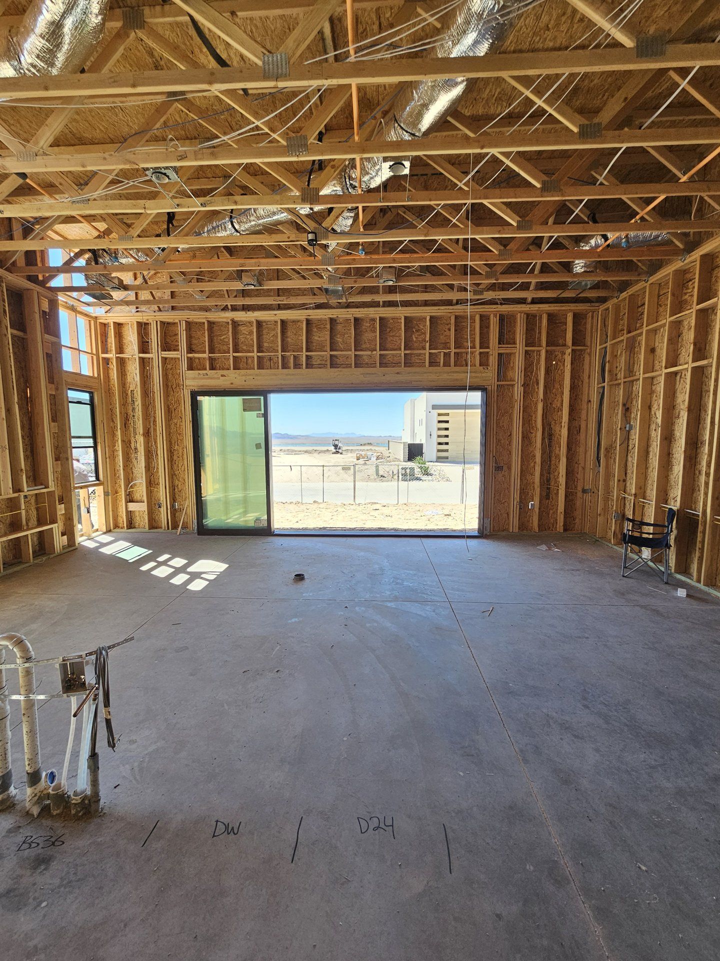Milgard multislide patio door opening to a desert view, installed by High Desert Window and Glass