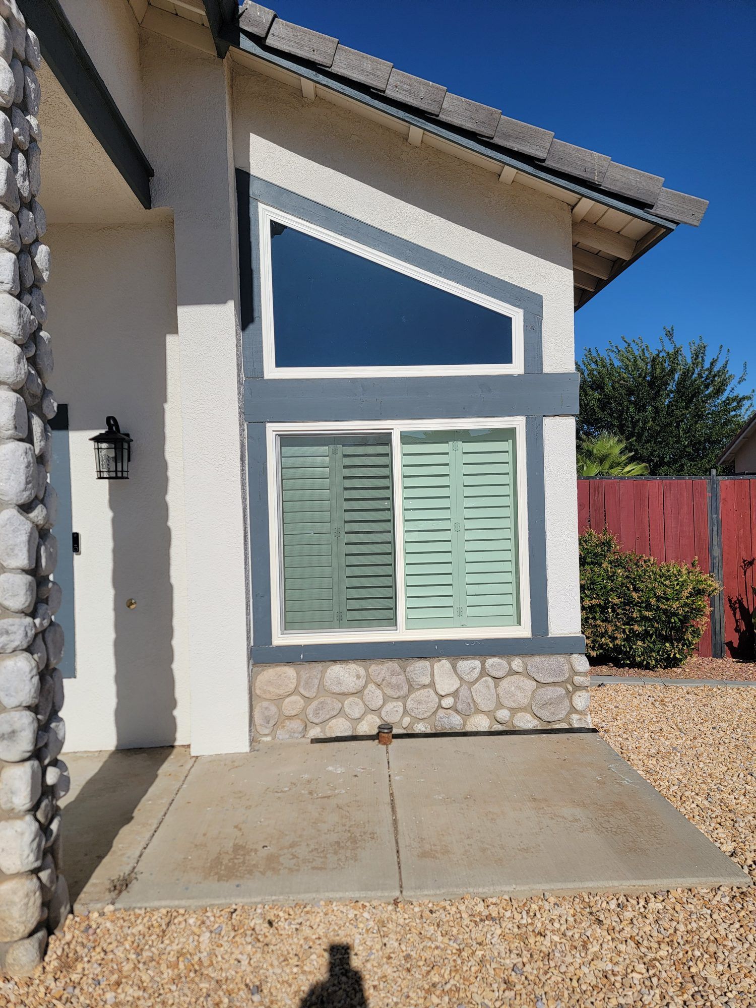 White vinyl retrofit shaped gable window installed by High Desert Window and Glass