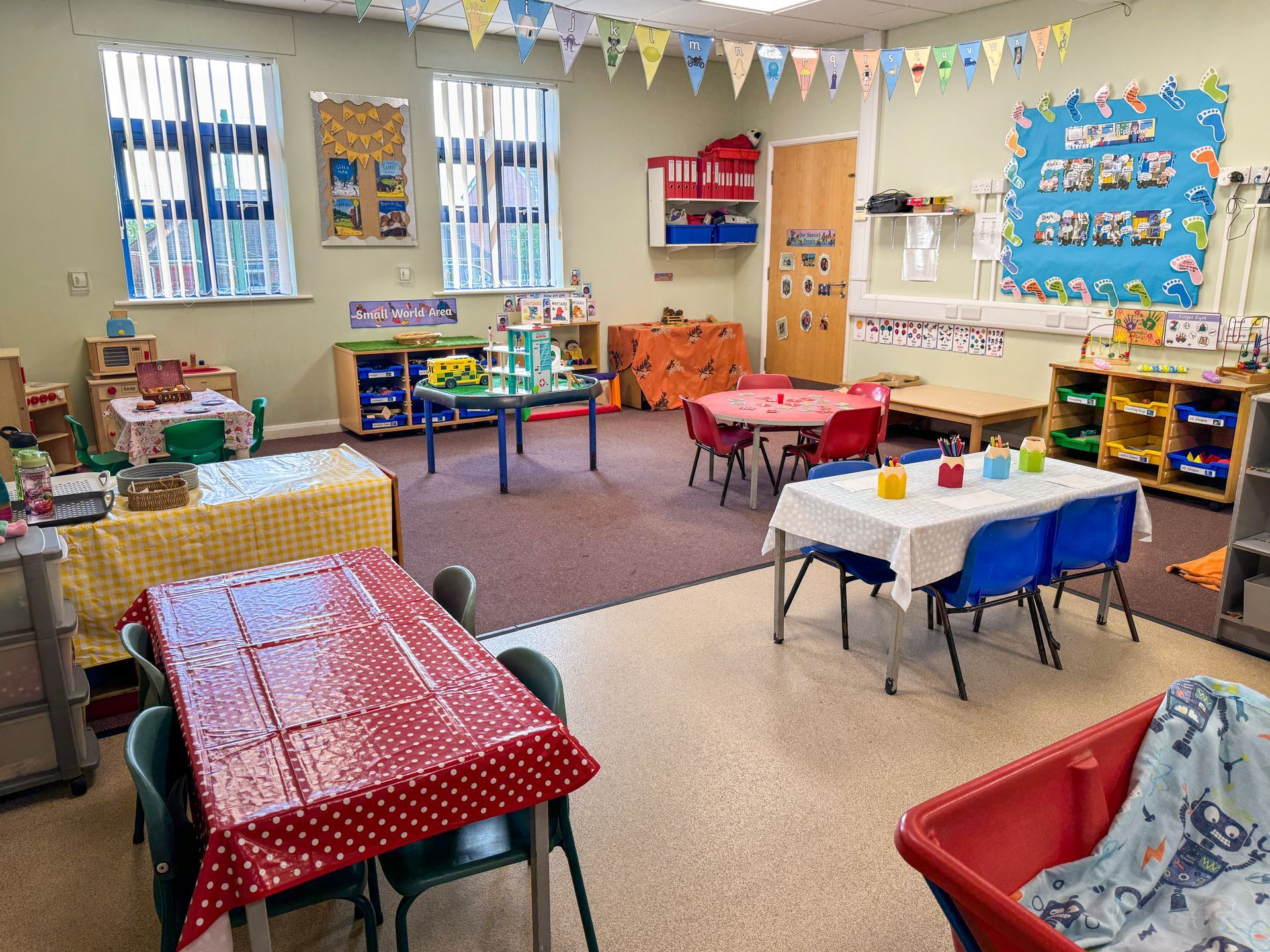 Bright and colourful nursery playroom at Railway Children Day Care in Barnsley