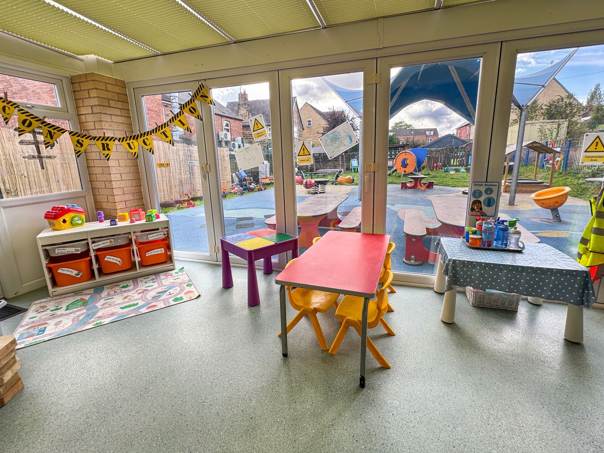 Bright nursery playroom overlooking the outdoor area in Barnsley