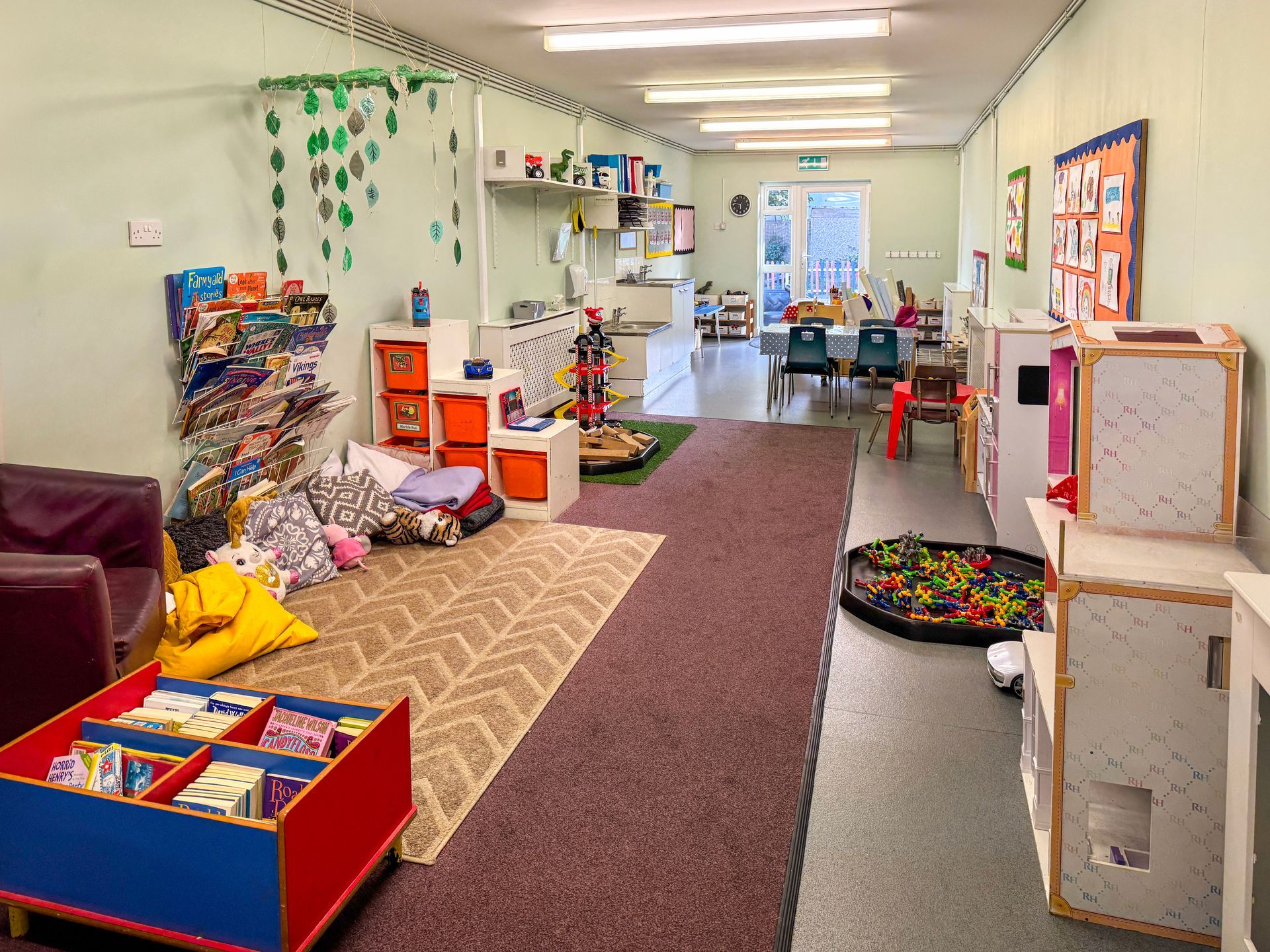 Spacious indoor playroom at Railway Children Day Care in Treeton