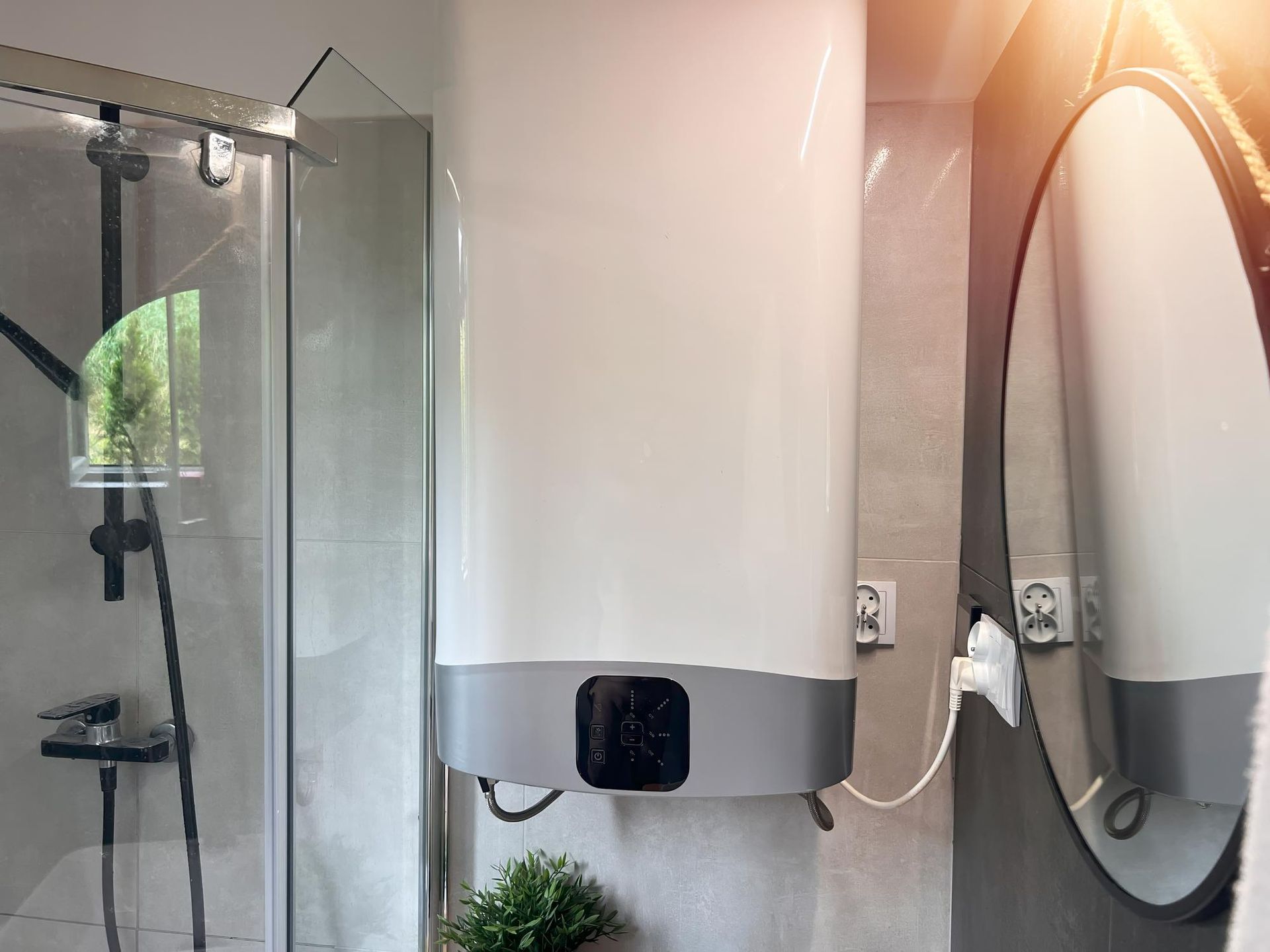 A bathroom with a water heater and a mirror.