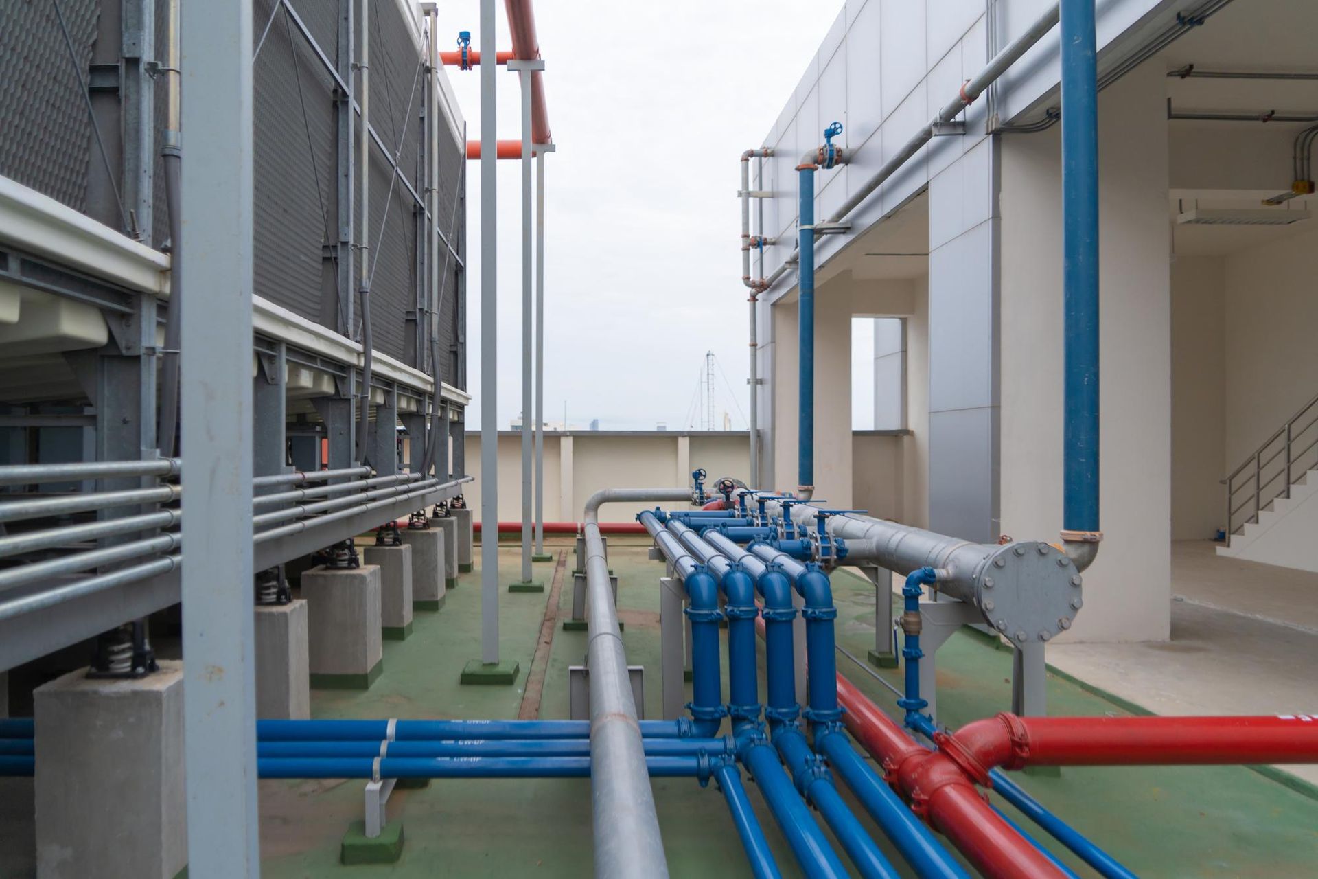 A bunch of pipes are connected to each other in a building.