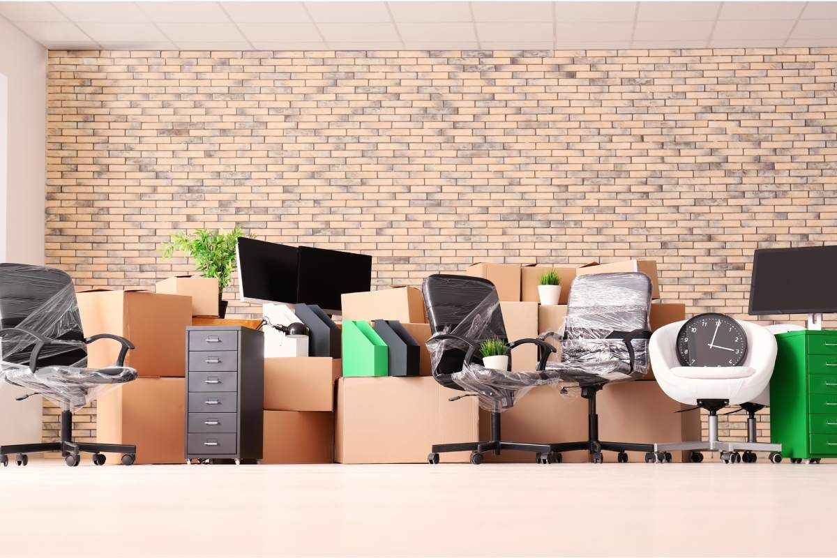 Office with moving boxes, stray electronic equipment being packed away near Nicholasville, Kentucky (KY).