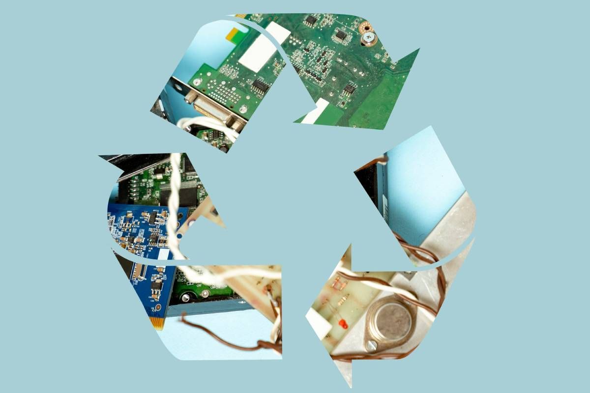 Old electronic parts inside of recycle symbol near Versailles, Kentucky (KY)