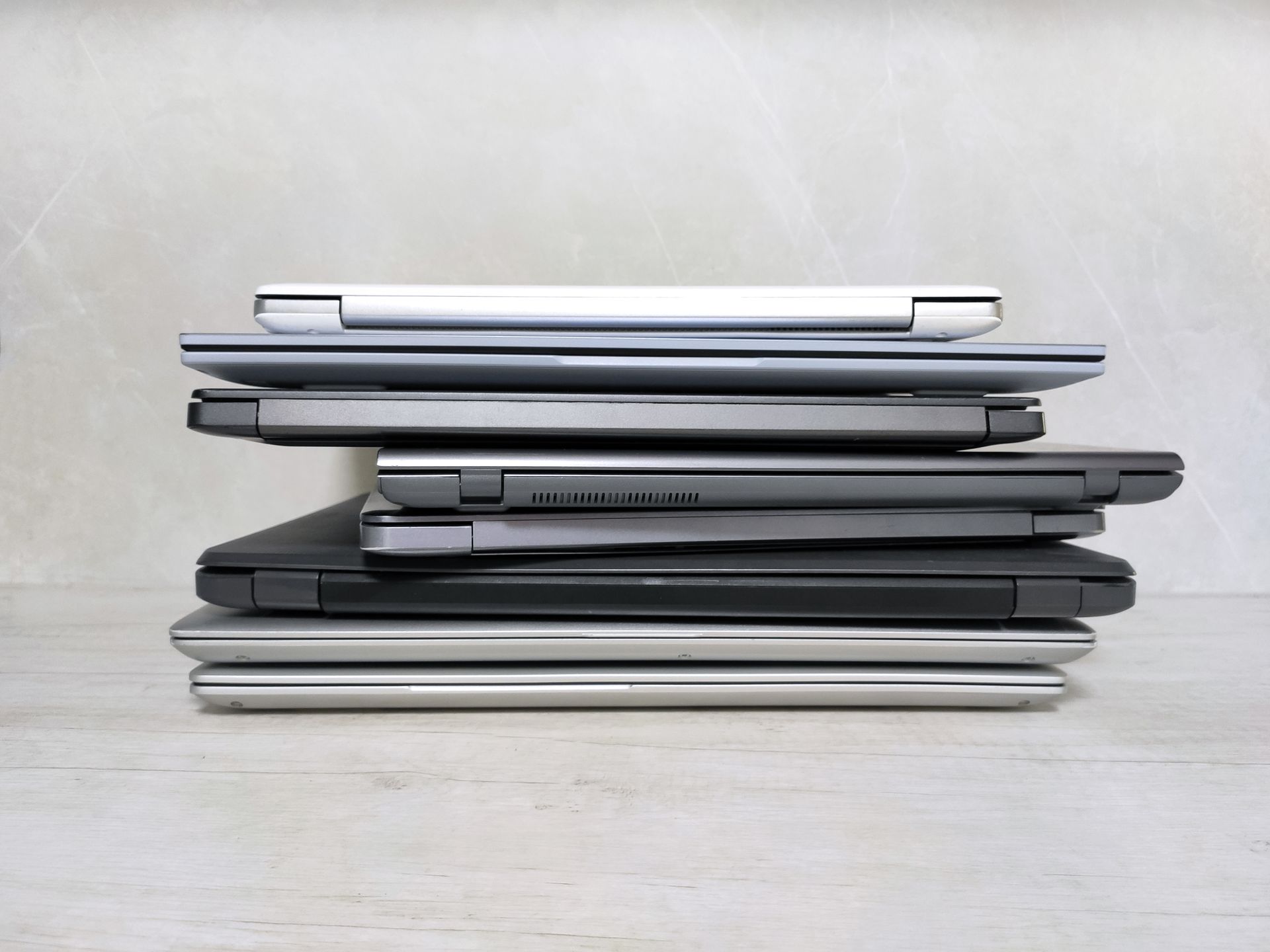 Stack of refurbished laptops ready for redeployment or resale near Lexington, KY