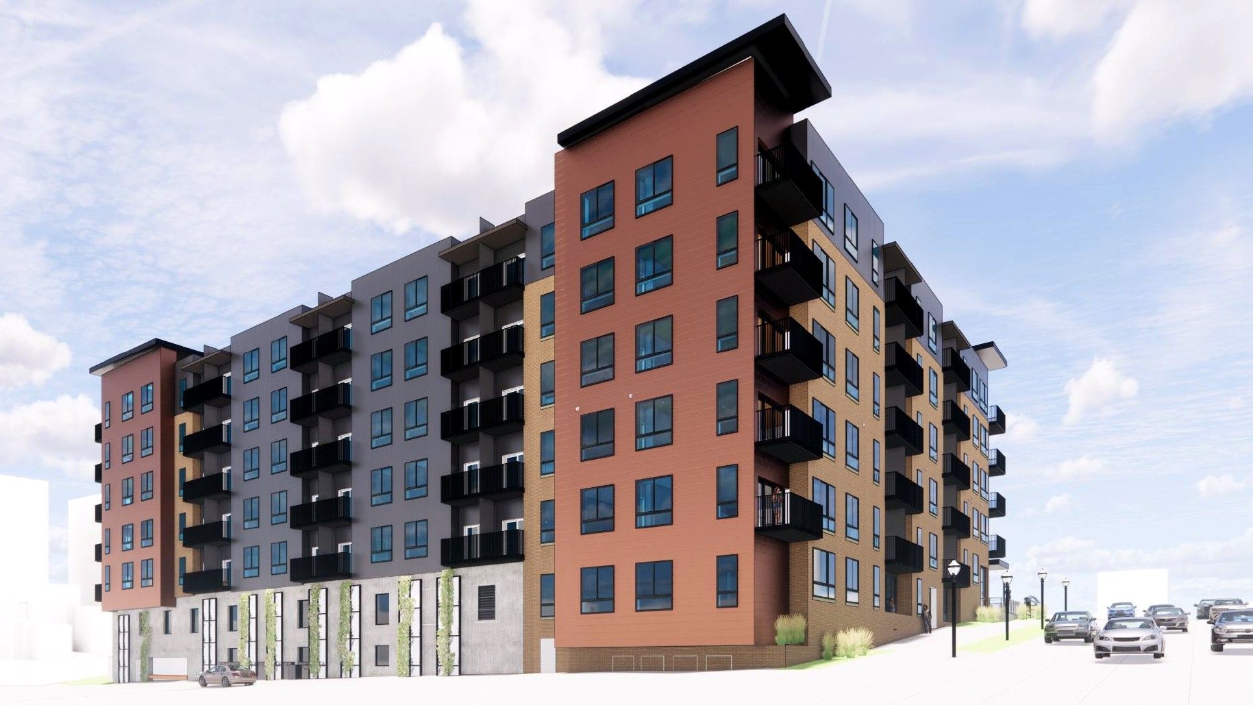 Modern apartment building with brown, black, and blue facades along a street under a cloudy sky