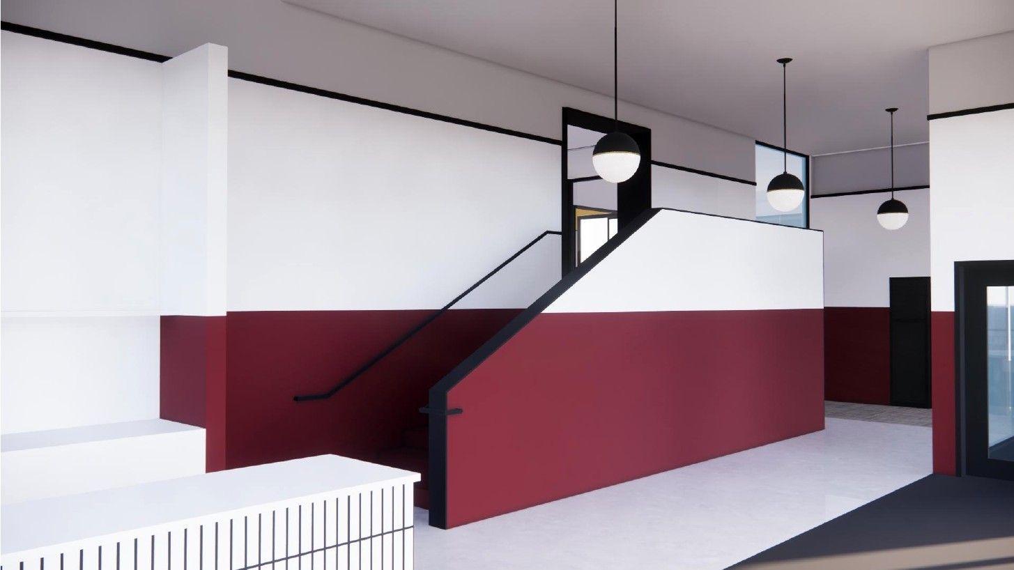 Modern interior with white walls, maroon staircase railing, hanging lights, and a white bench area.
