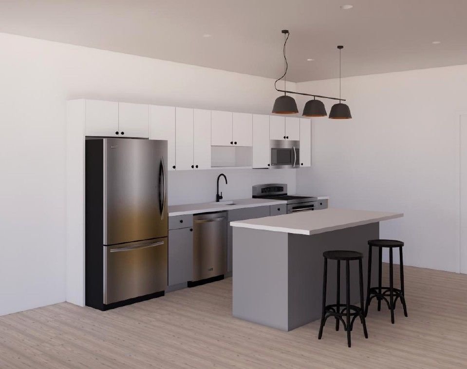 Modern white kitchen with stainless steel appliances, island, and two black stools