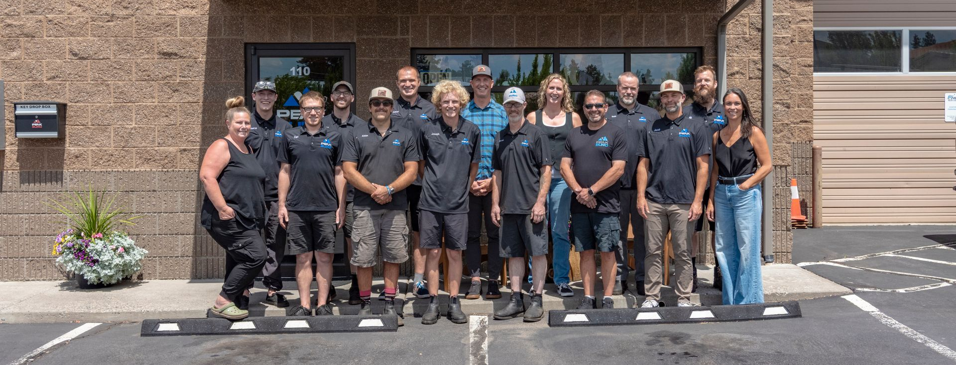 Peak Euro auto repair team in Bend, Oregon standing in front of the shop