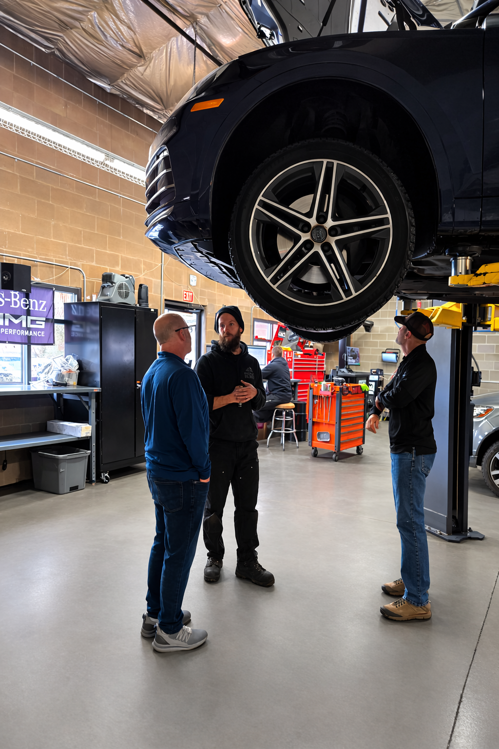 Audi SQ5 inspection at Peak Euro in Bend Oregon showing technicians reviewing the vehicle