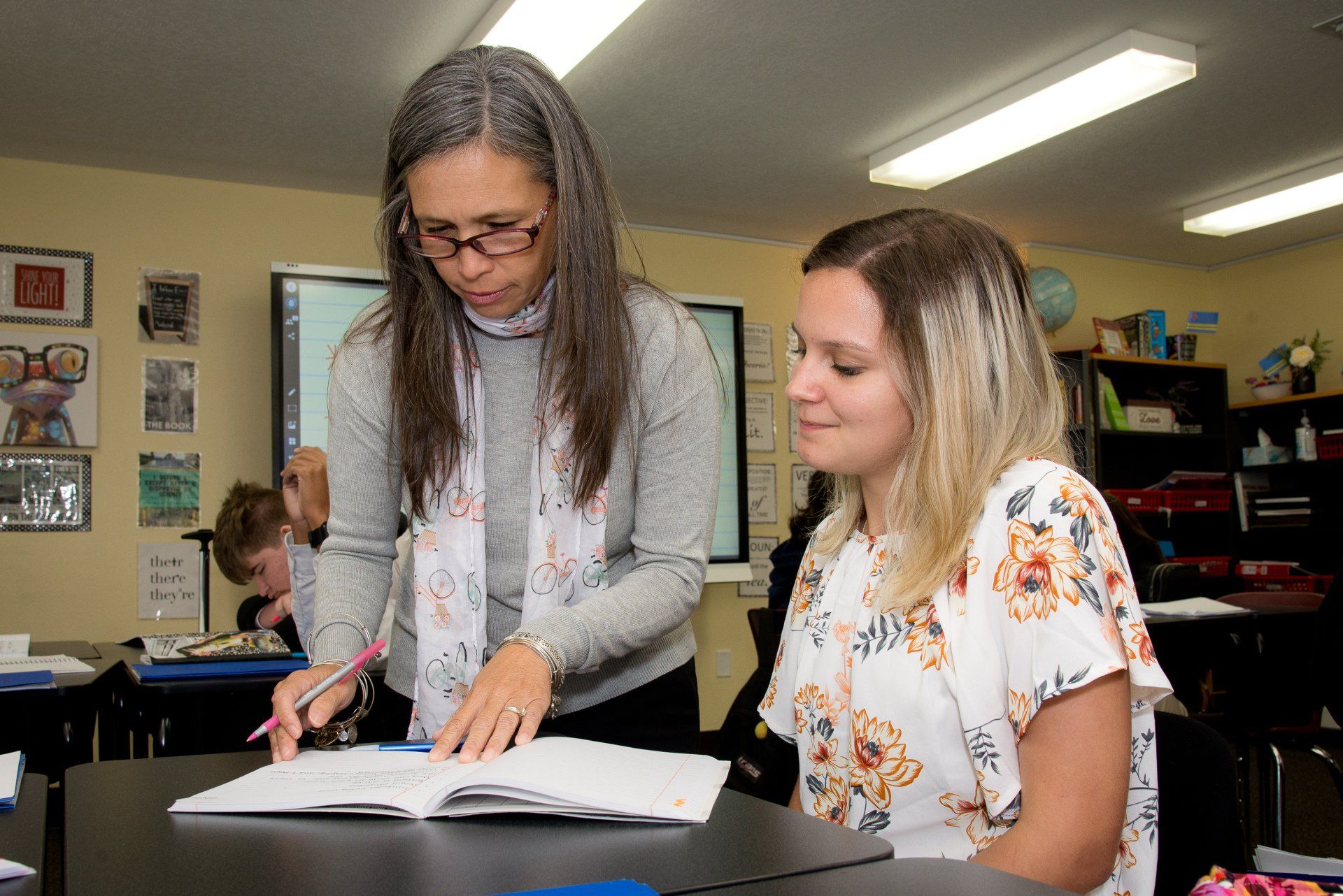Teacher Sonia helping a Student