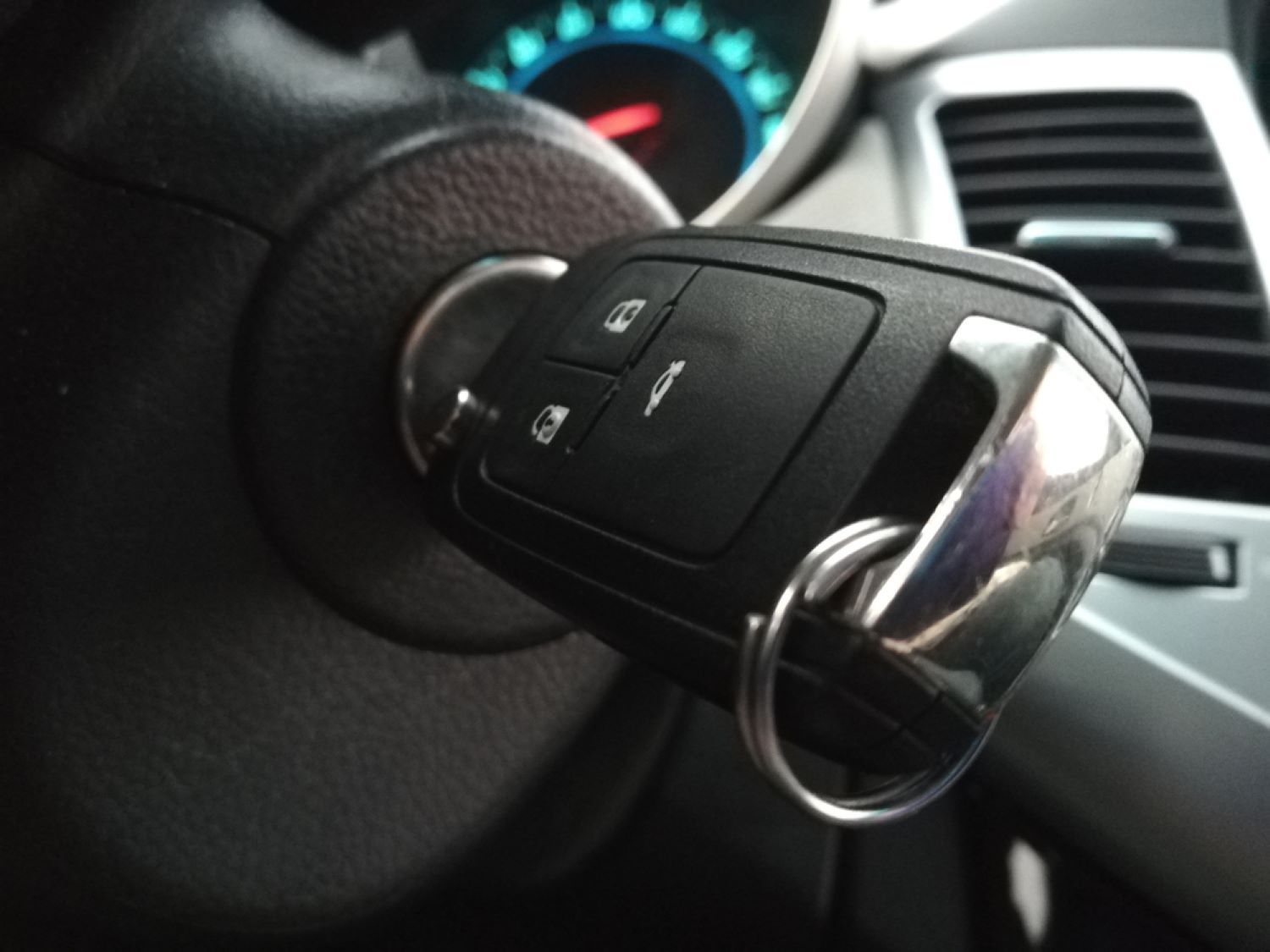 A Close up Of a Car Key on The Steering Wheel — Toowoomba Locksmiths in Highfields, QLD