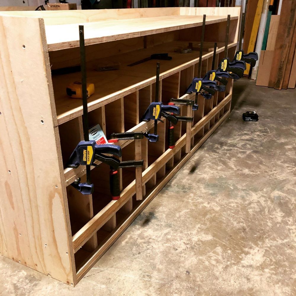 A Wooden Shelf with A Bunch of Clamps on It — Toowoomba Locksmiths in Toowoomba City, QLD