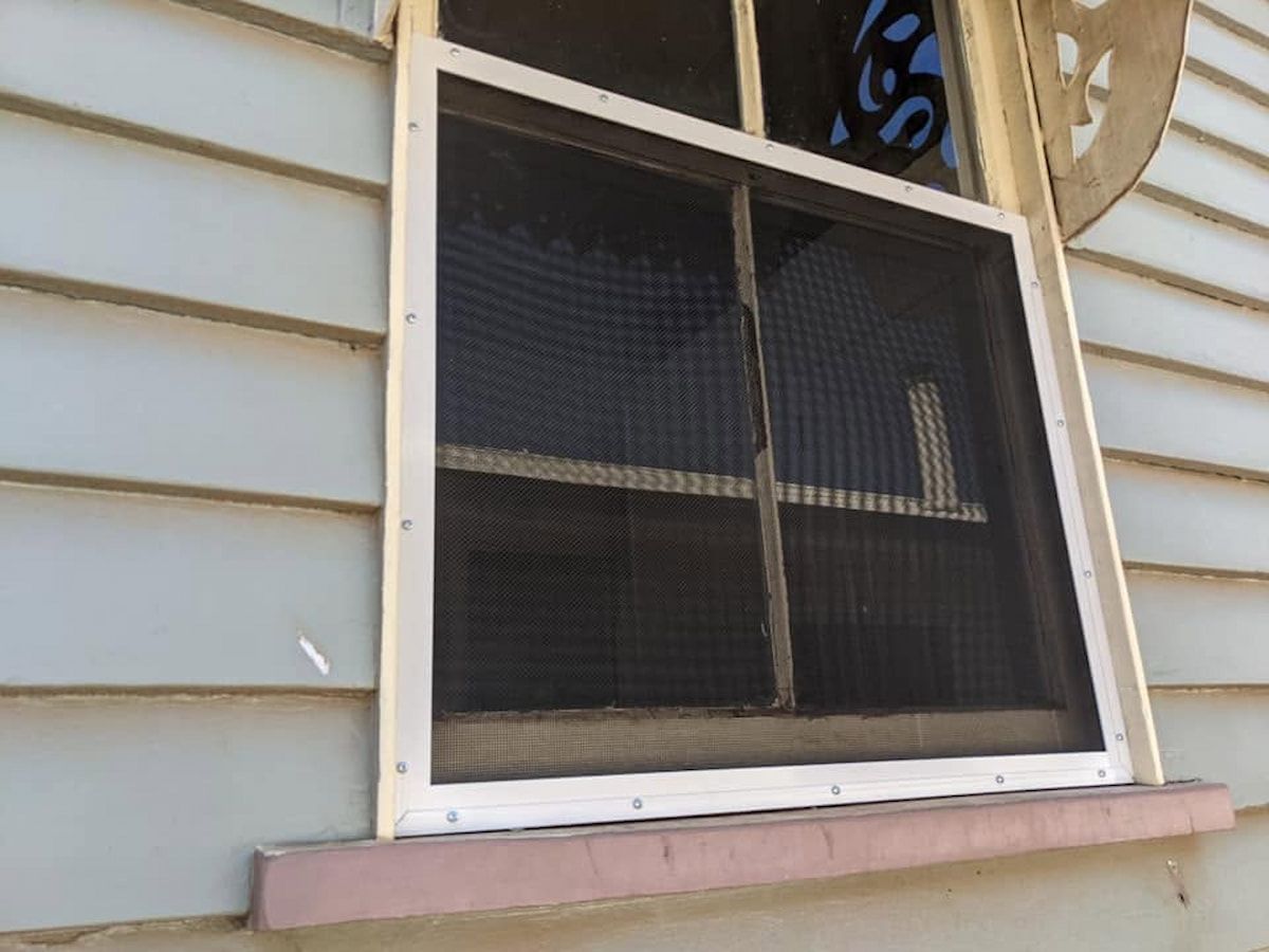 Close-up of a Screened Window on a Light-sided House — Toowoomba Locksmiths in Toowoomba City, QLD