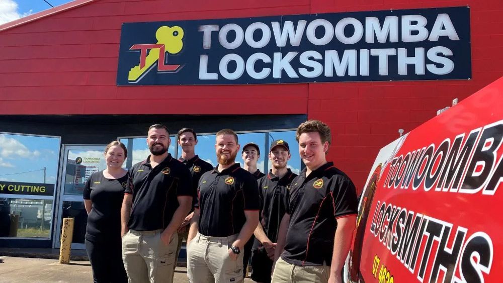 Group of People Standing in Front of A Toowoomba Locksmiths Store — Toowoomba Locksmiths in Toowoomba City, QLD