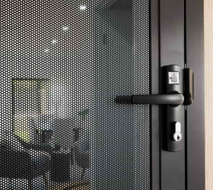 A Screen Door with A Handle — Toowoomba Locksmiths in Toowoomba City, QLD