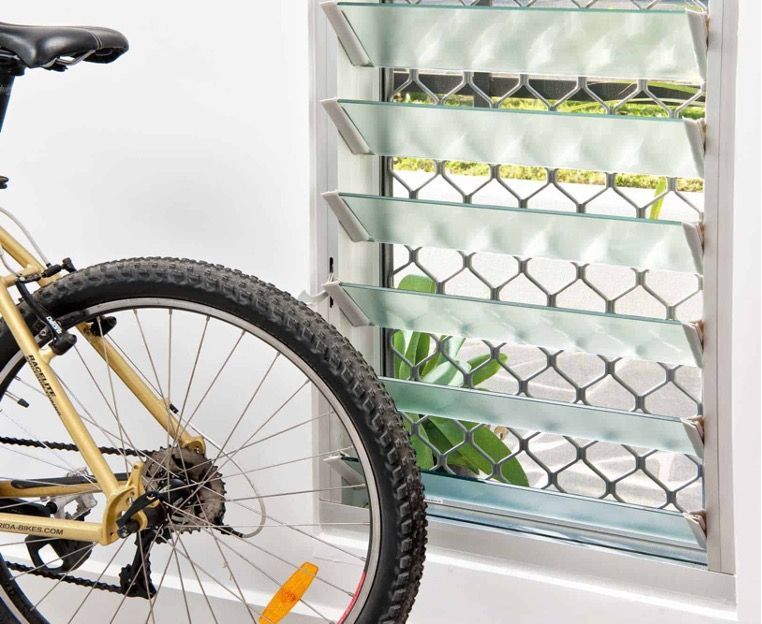 A Bicycle Is Parked in Front of A Window — Toowoomba Locksmiths in Toowoomba City, QLD