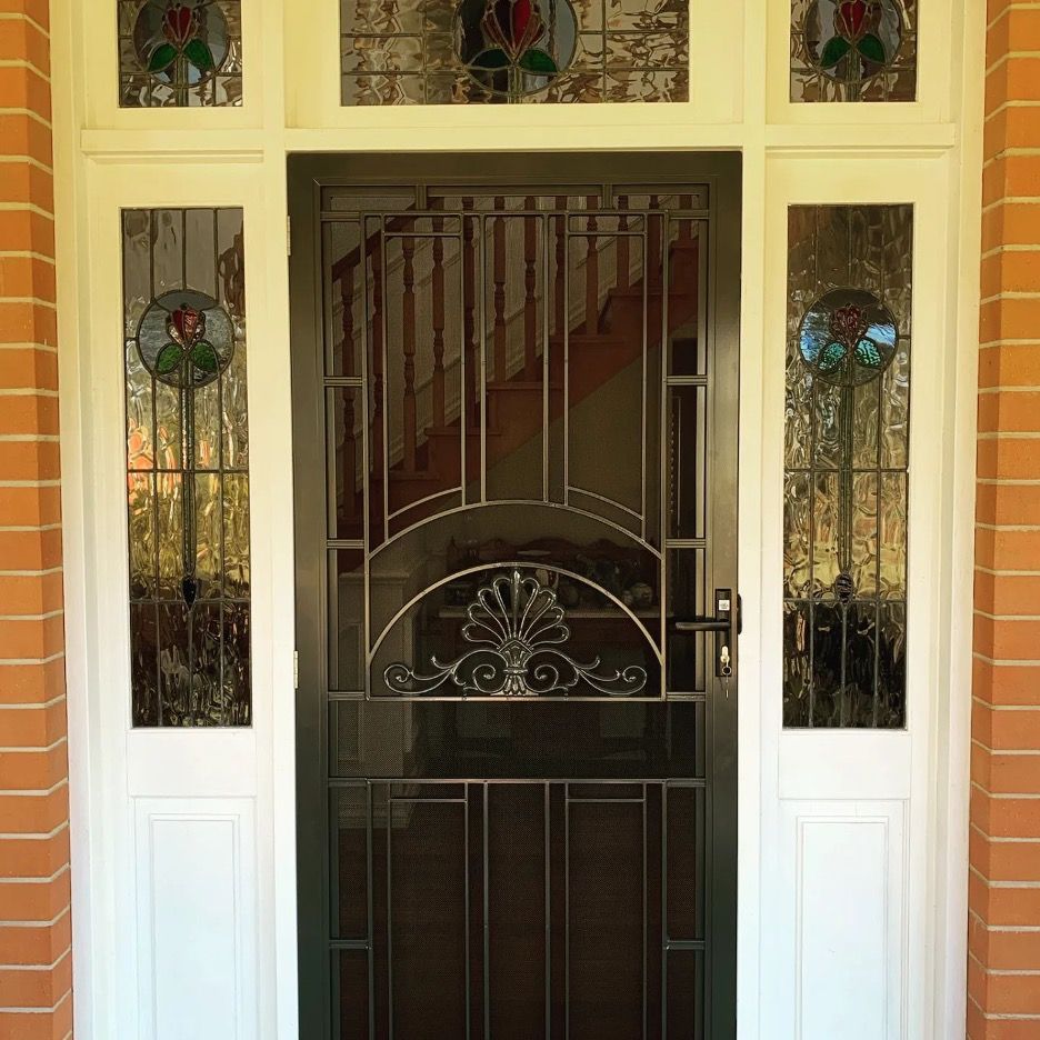 A Door with Stained Glass Windows and A Staircase — Toowoomba Locksmiths in Toowoomba City, QLD