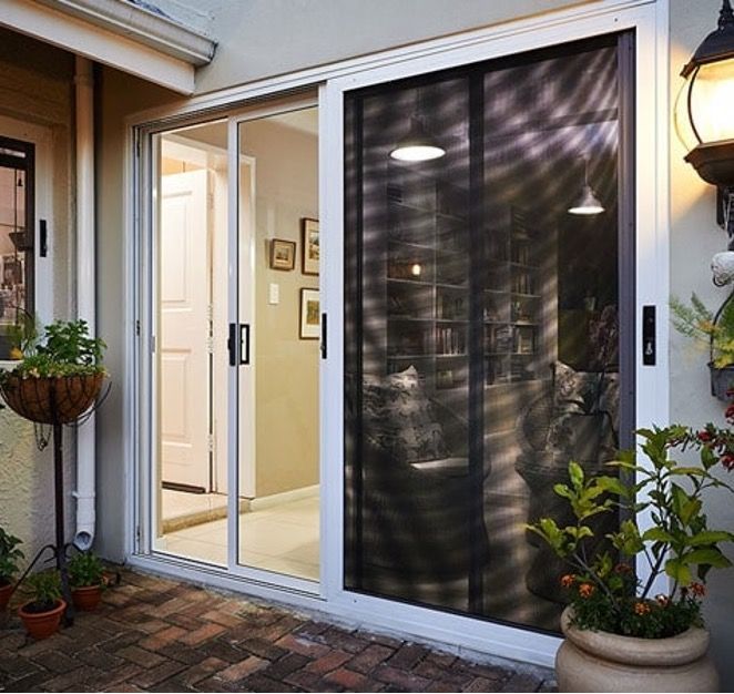 A Sliding Glass Door with A Screen on It — Toowoomba Locksmiths in Toowoomba City, QLD