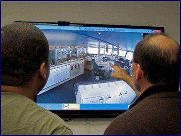 Photo of two people looking at a digiView camera feed