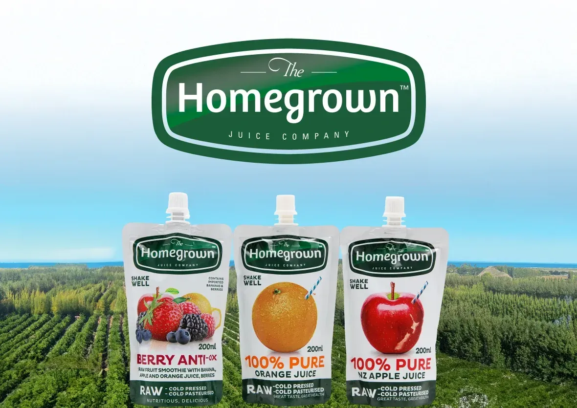 Homegrown fruit company ad with juice cartons in a green orchard