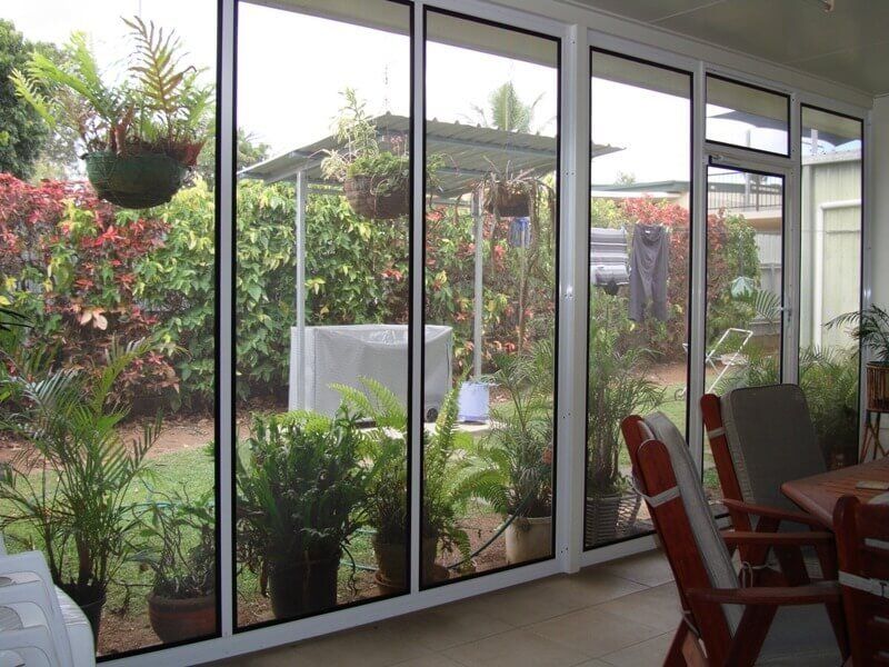 Glass Door With Outdoor Plants- Security Fitters in Cairns, QLD