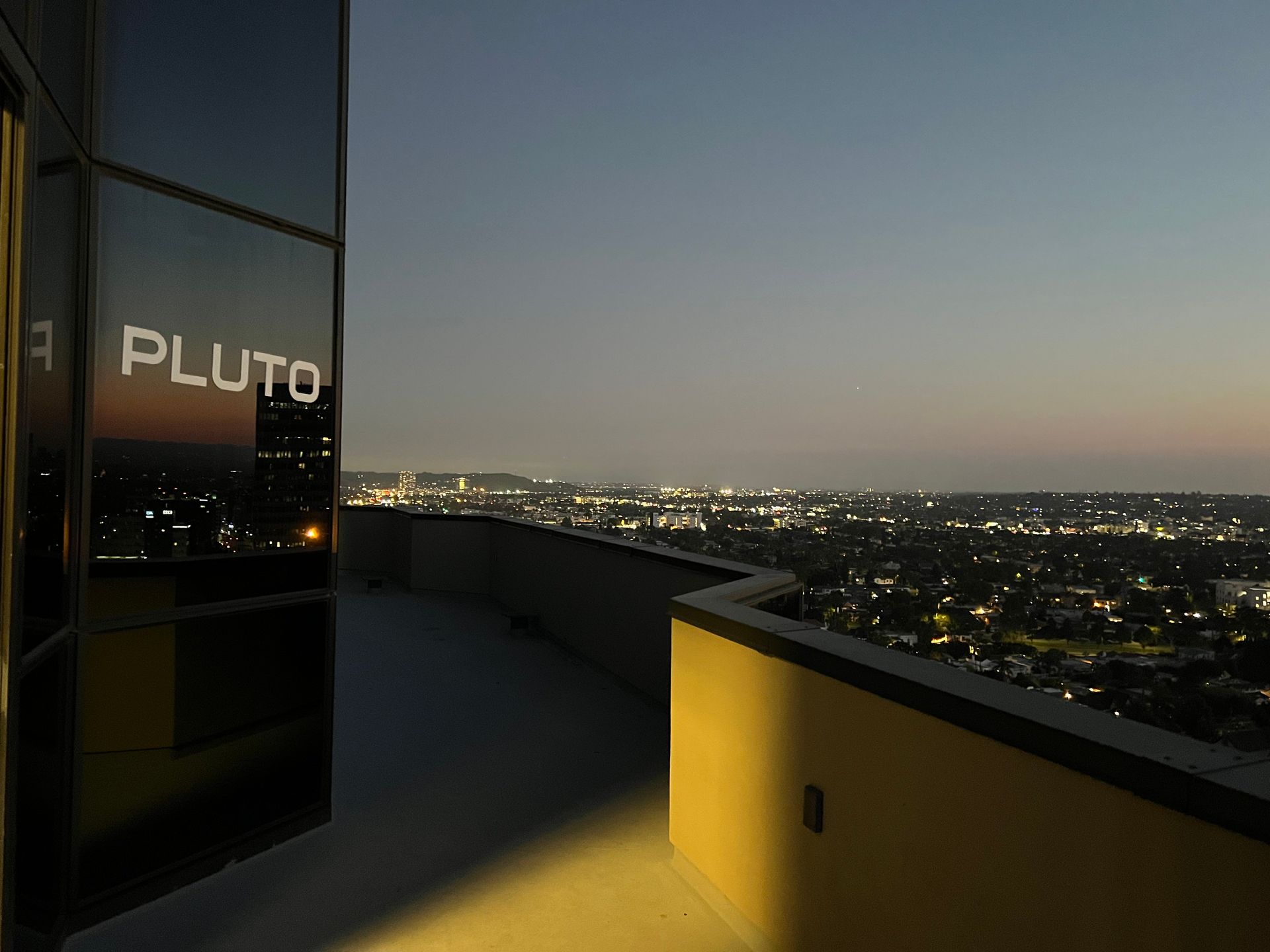 The word pluto that is on a building