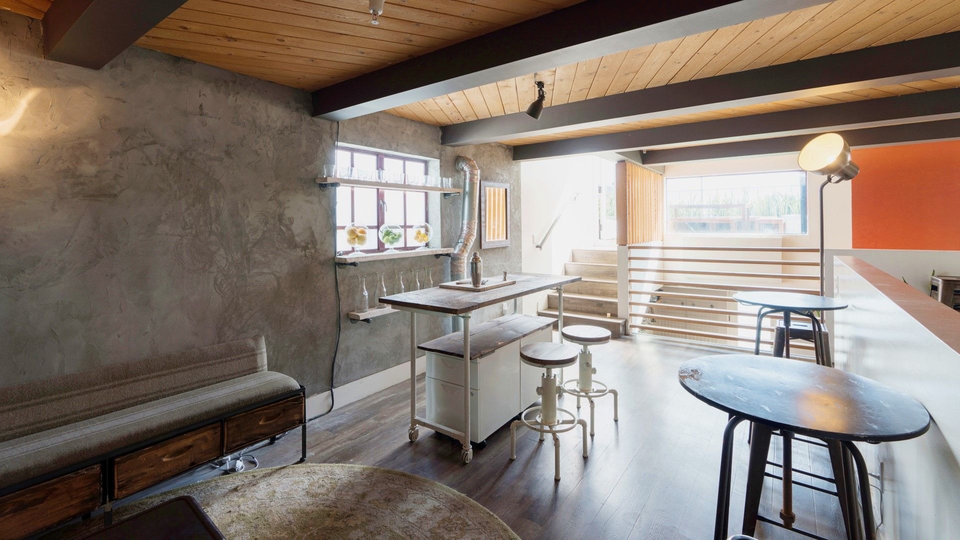 A living room with tables and chairs in it