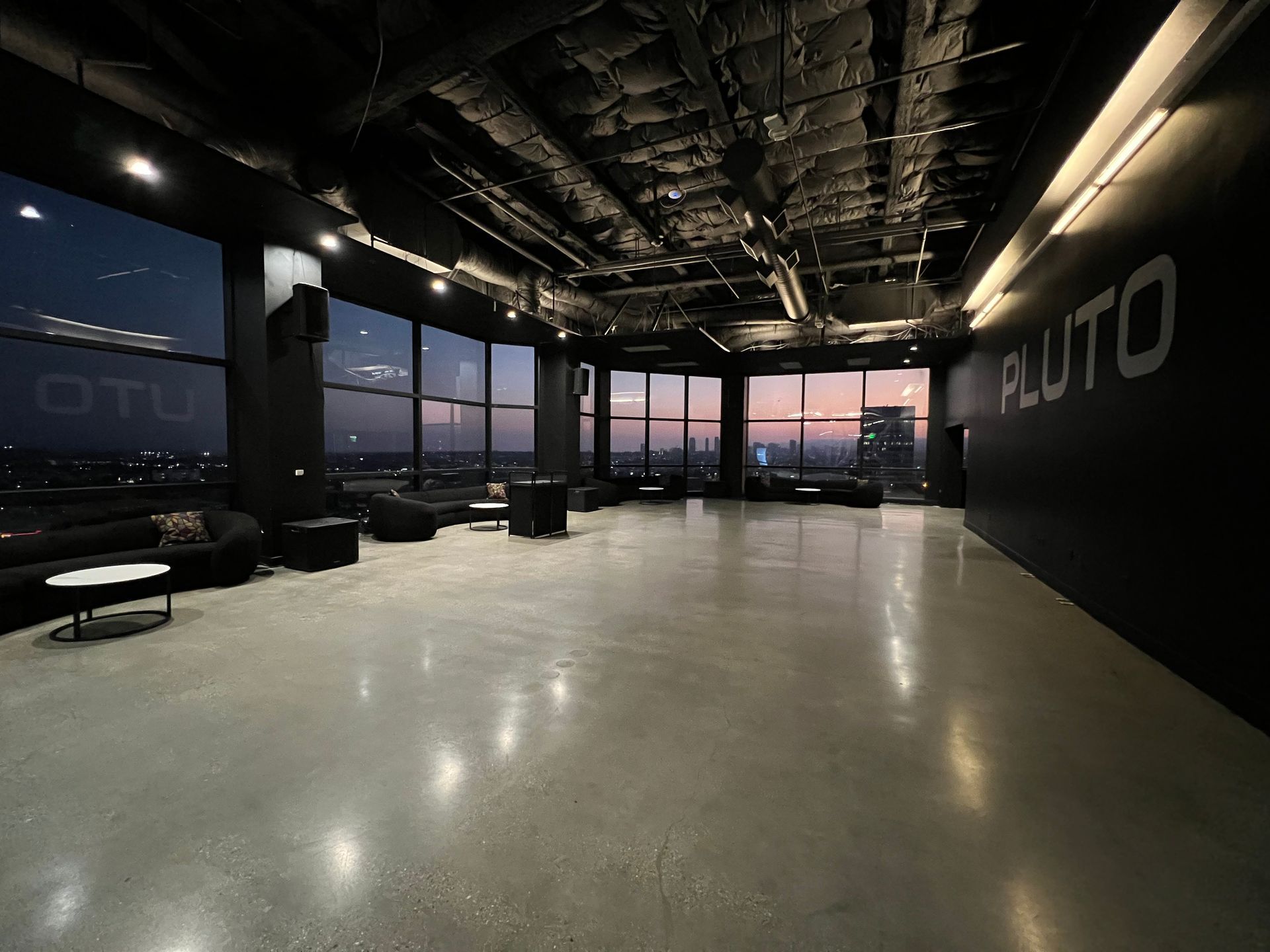 A large room with the word pluto on the wall