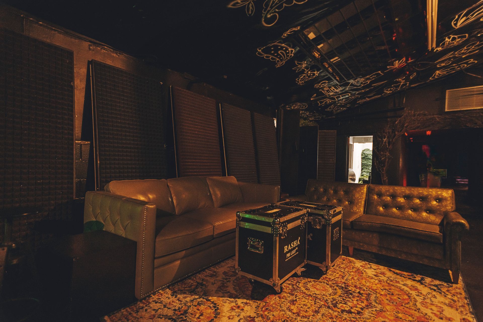 A living room with a couch a table and a rug