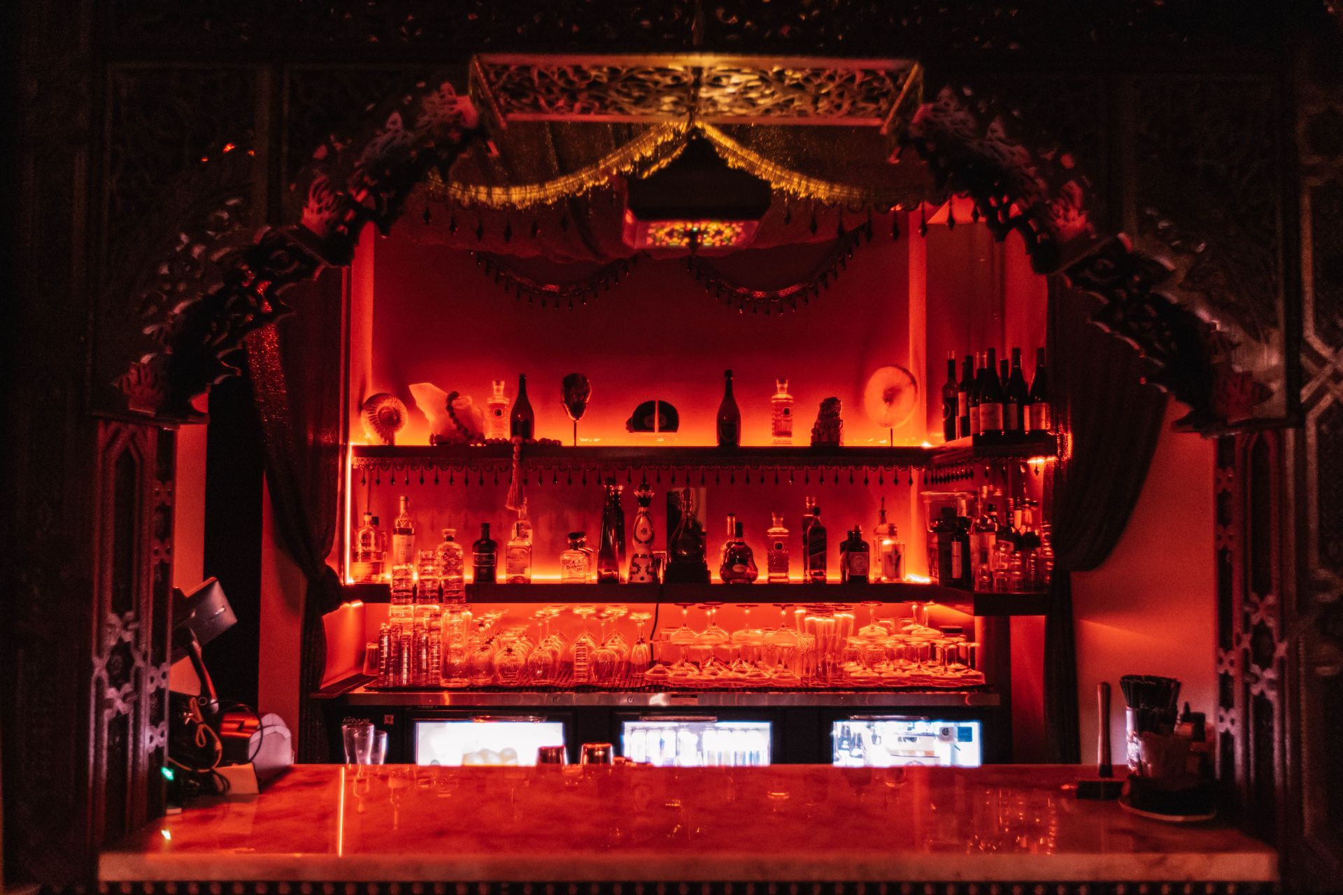 A bar with a lot of bottles on it