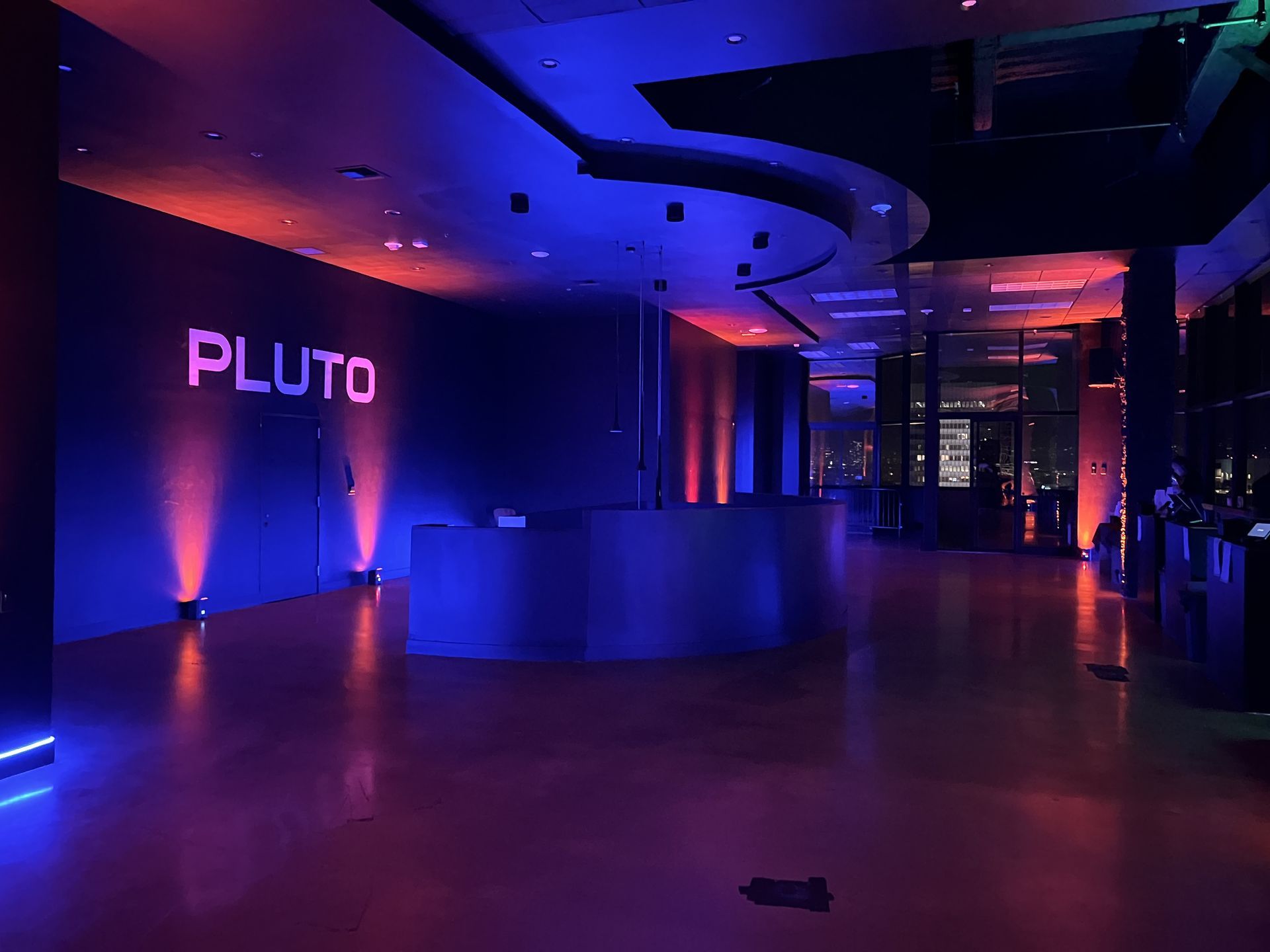 A large room with the word pluto on the wall