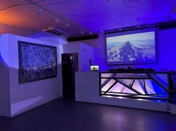 There is a projector screen in the middle of the room.