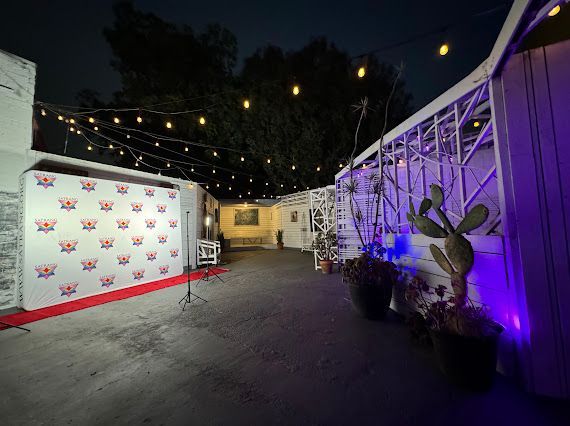 A large white building with a red carpet in front of it.