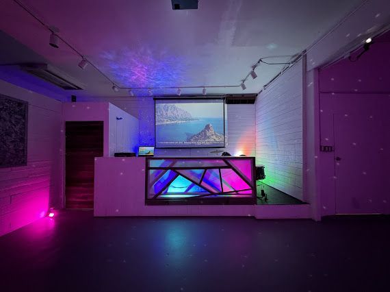 There is a projector screen in the middle of the room.