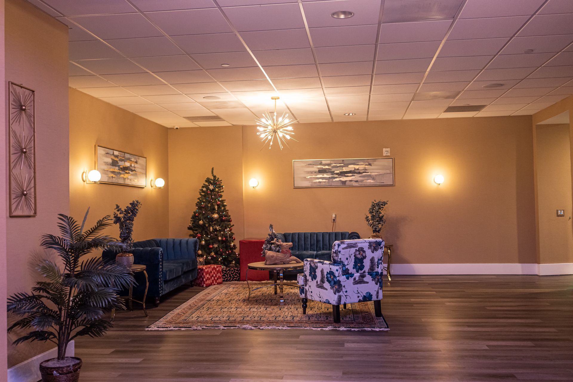 A living room filled with furniture and a christmas tree.