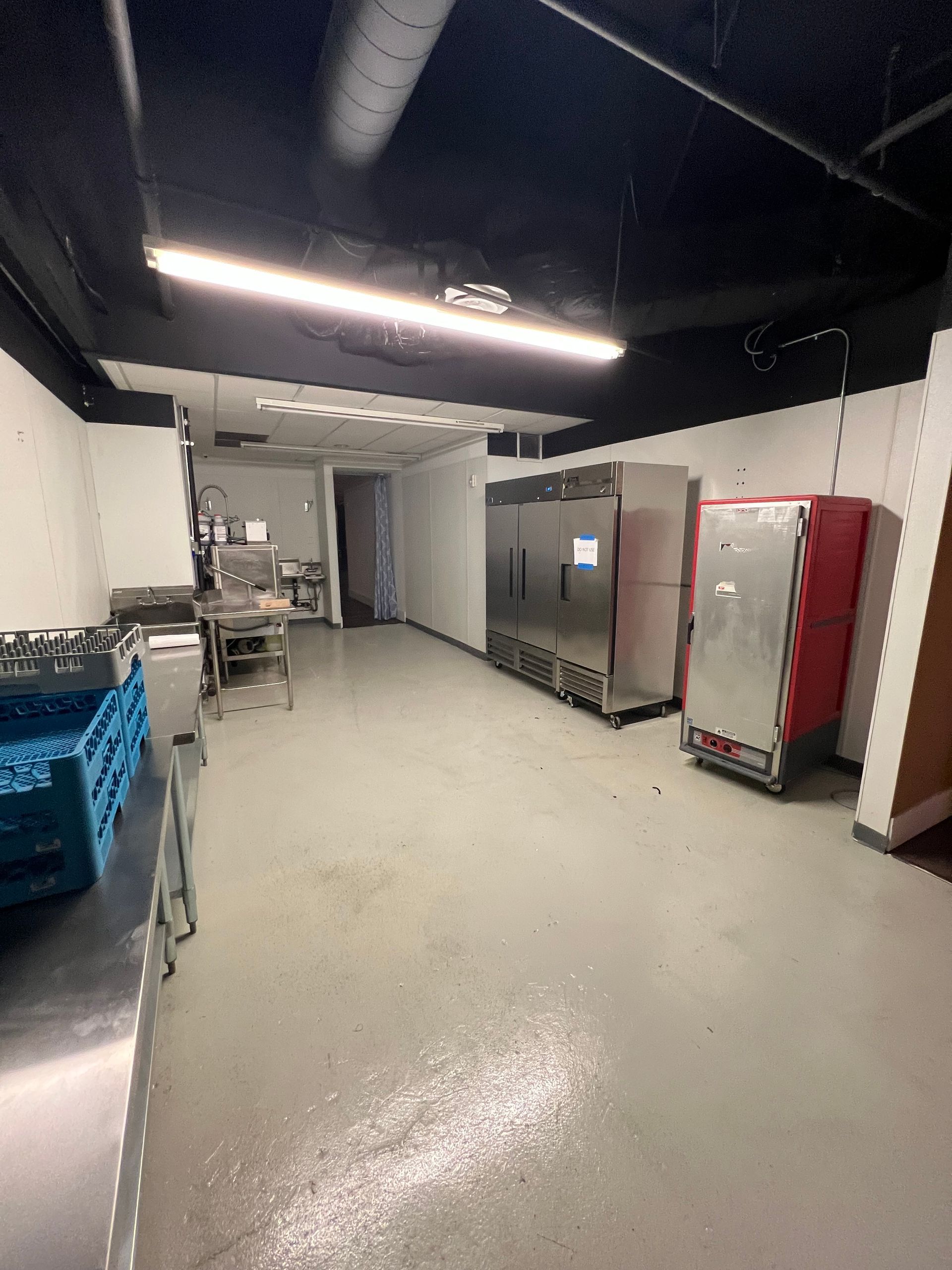 A large room with a lot of appliances in it.