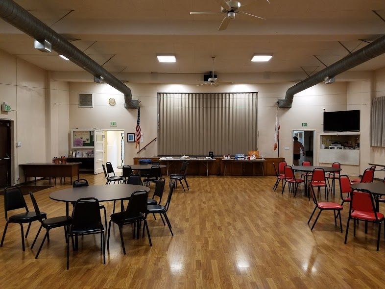 A large room with tables and chairs in it
