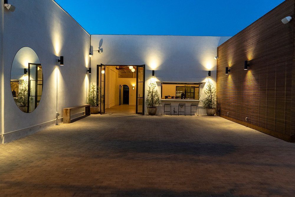 A large white building with a lot of lights on it
